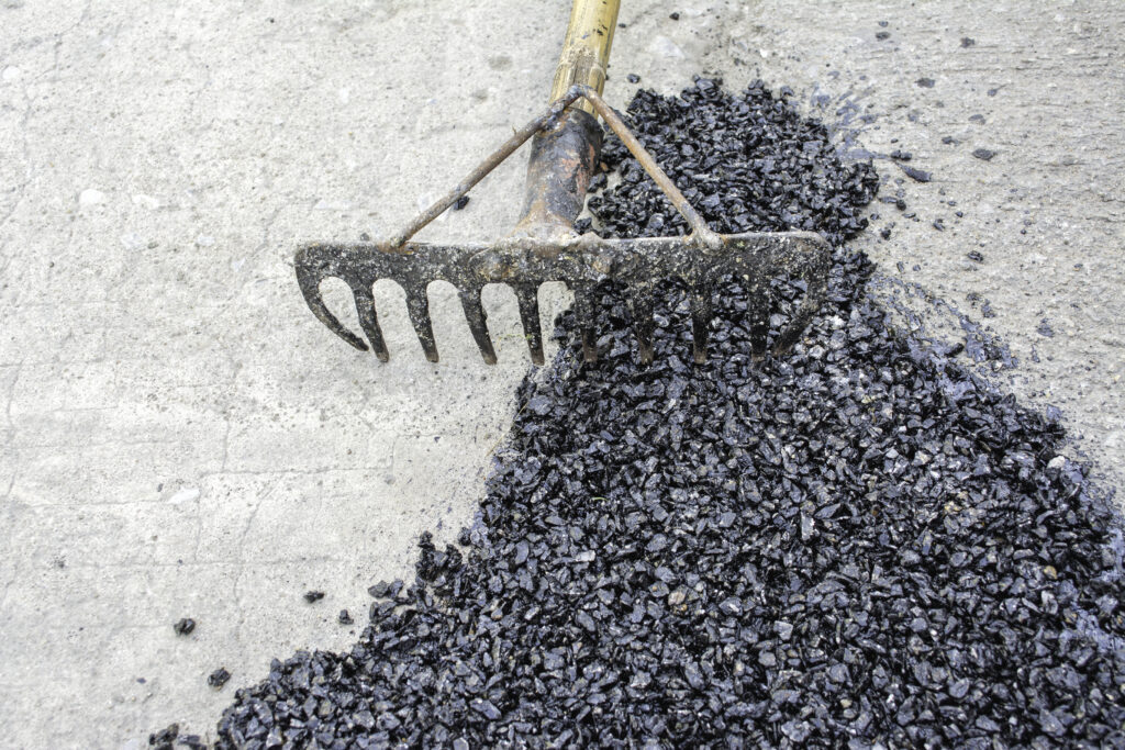 how to fix potholes in a gravel driveway
